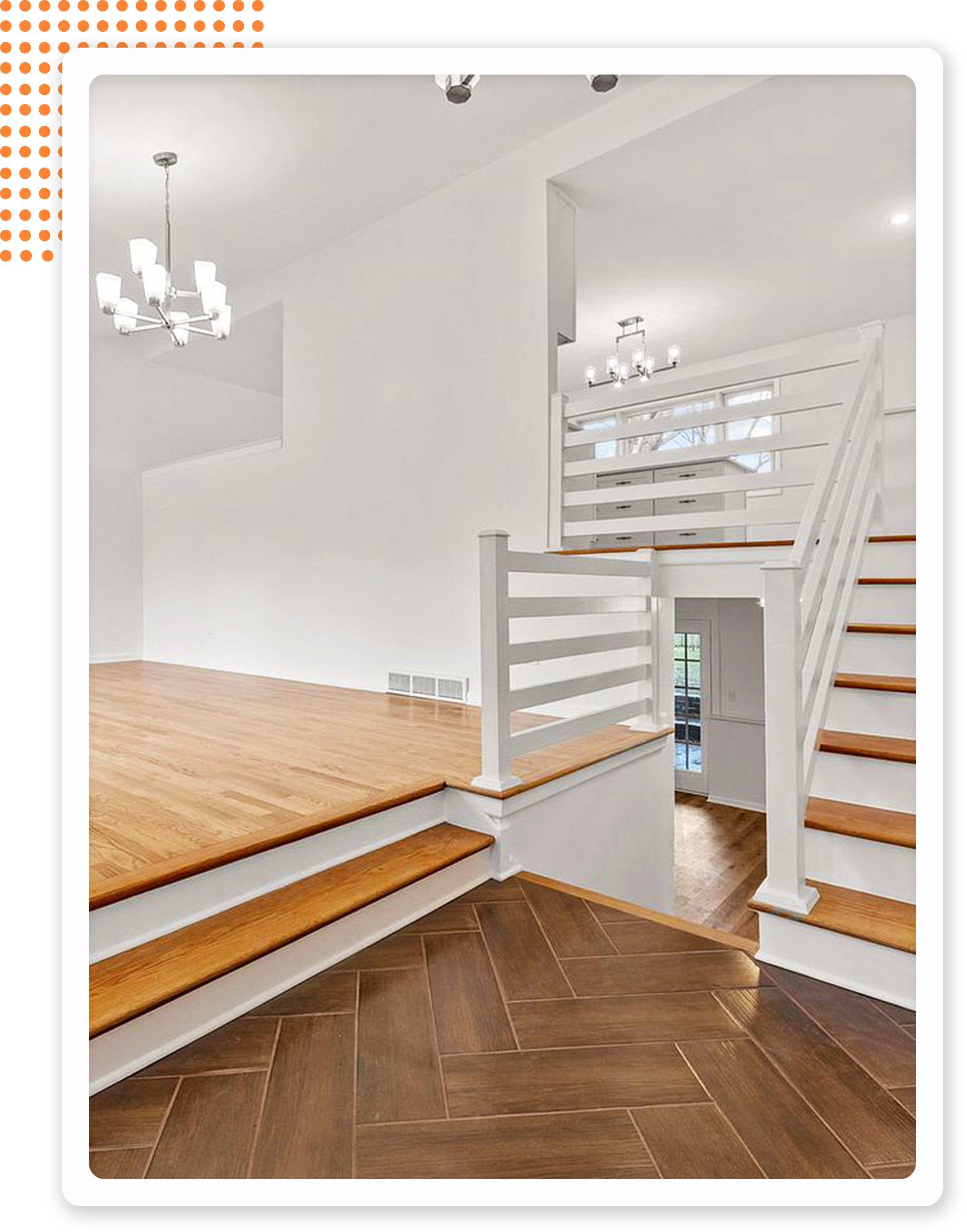 Bright, modern interior featuring wooden stairs, white railings, and a spacious open layout with hardwood flooring.
